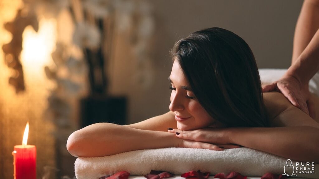 A person enjoying a relaxing in-home massage in a cozy, serene setting with soft lighting, promoting stress relief and allergy symptom relief.